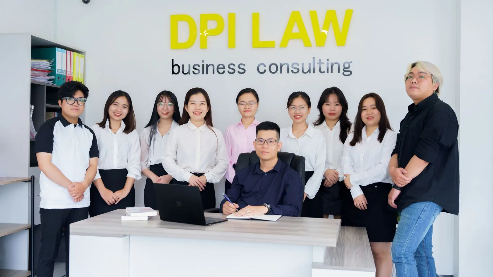 A diverse group of professionals in a business consulting office setting.